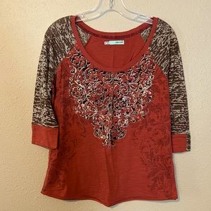 3/4 sleeve shirt with design on sleeves and front of shirt